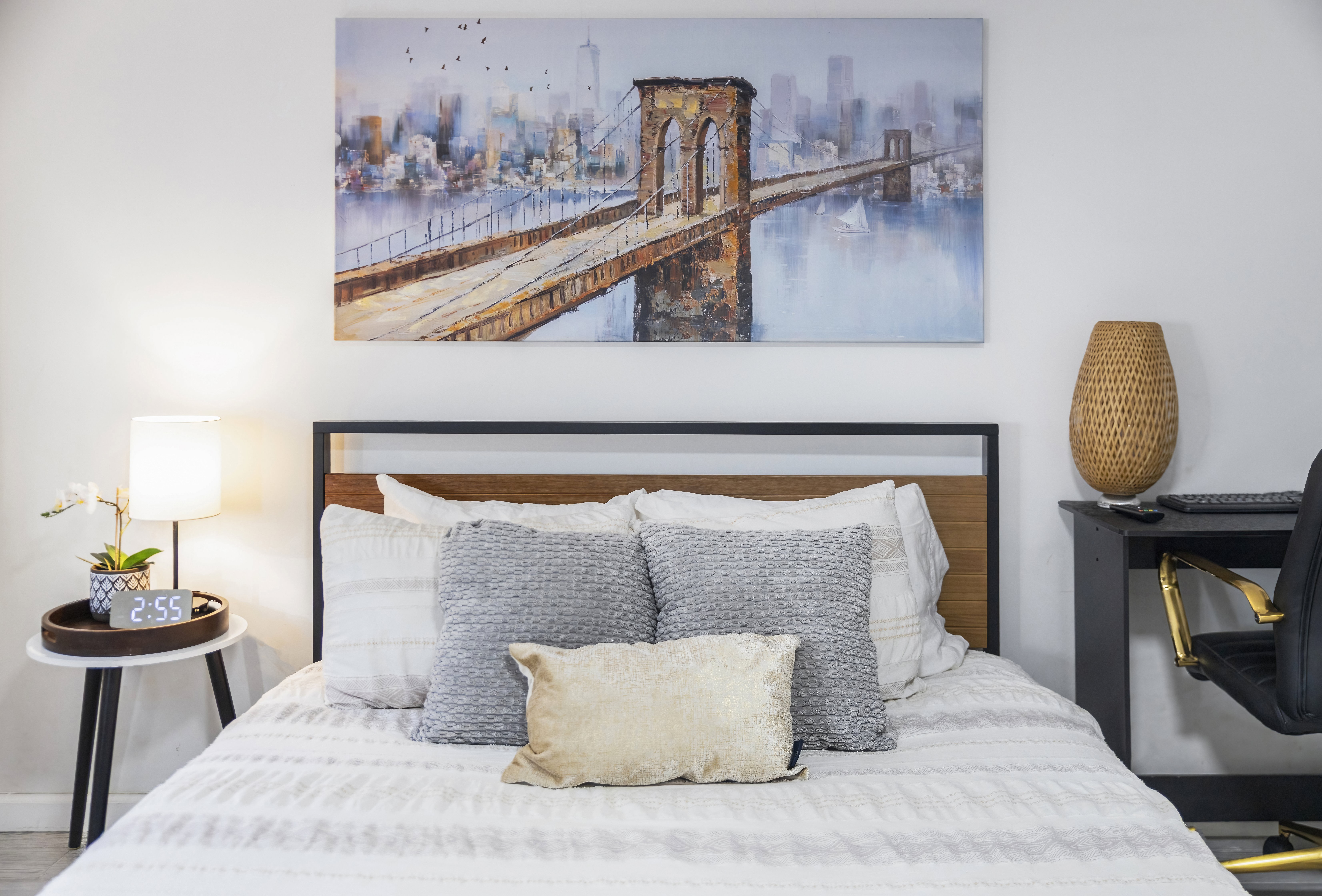 Plush queen bedroom with soft neutral bedding